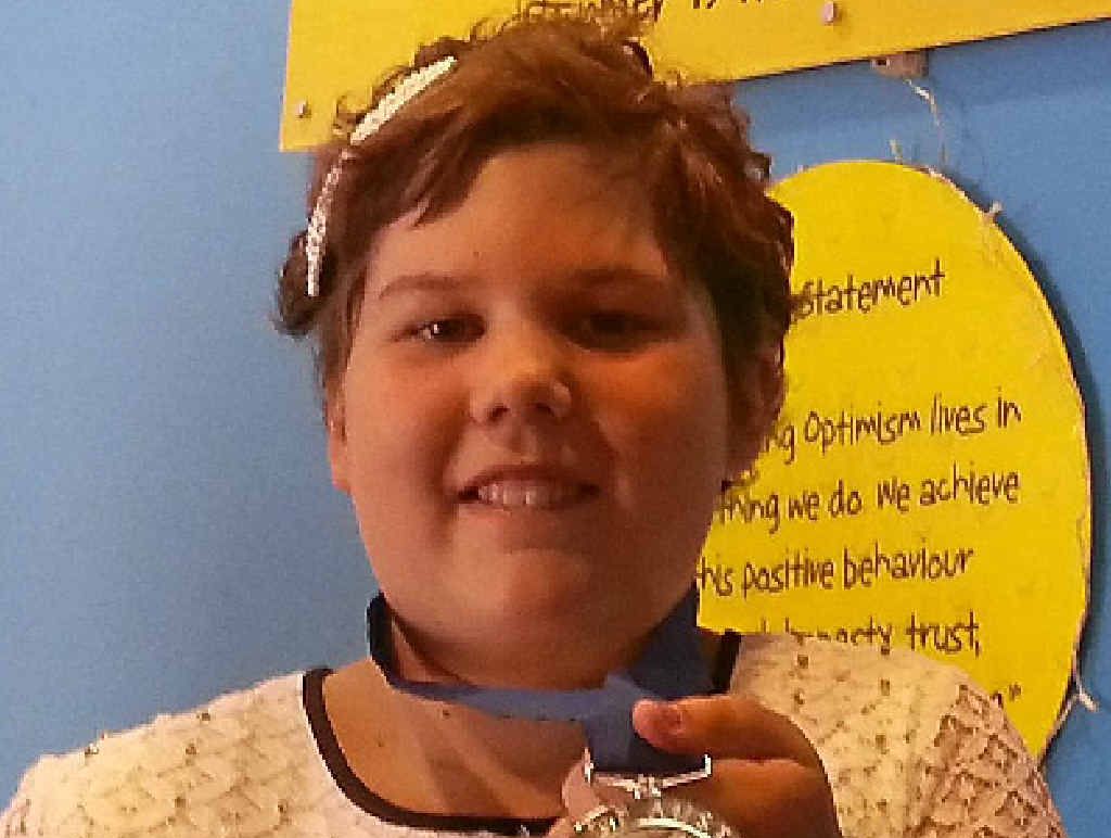 Caitlyn Meiklejohn with her Queensland Pride of Australia Child of Courage medal. Caitlyn Meiklejohn with her Queensland Pride of Australia Child of Courage medal.